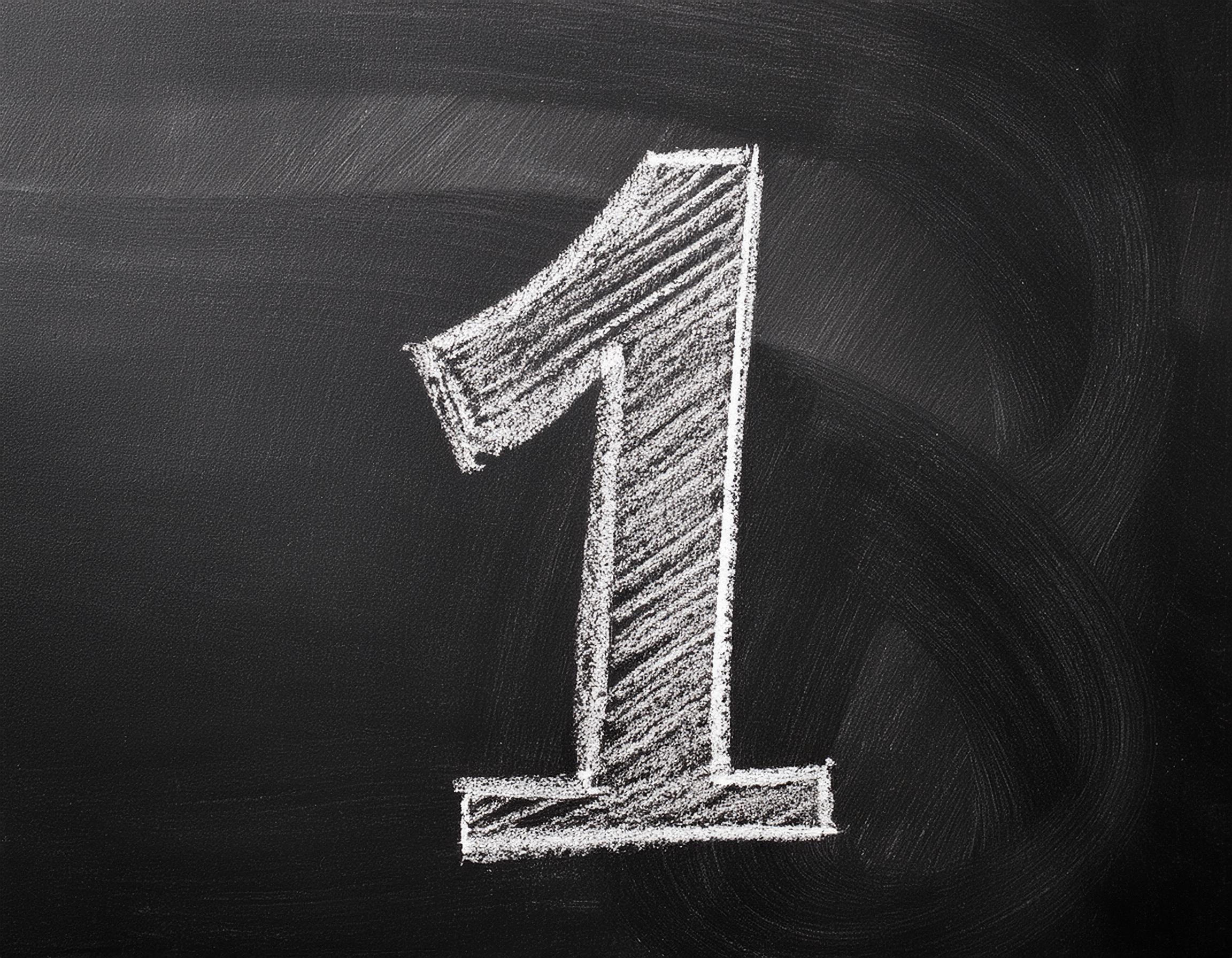 The number 1 on blackboard with chalk